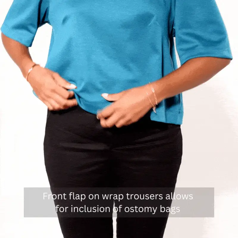 Woman demonstrates the front flap opening of black trousers